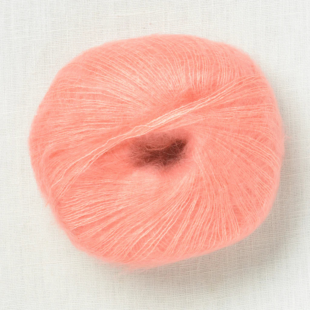 A fluffy ball of peachy pink yarn.