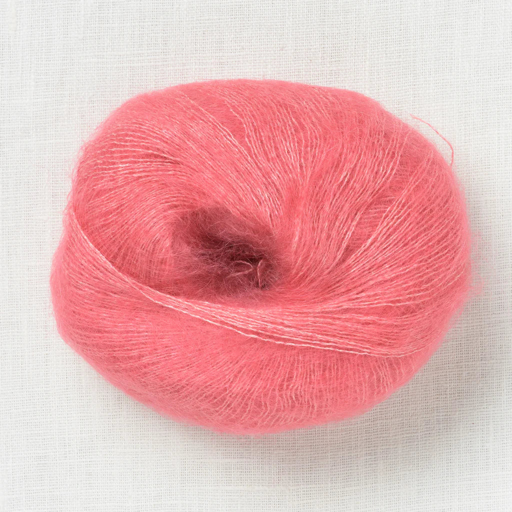 A fluffy ball of light salmon pink yarn.