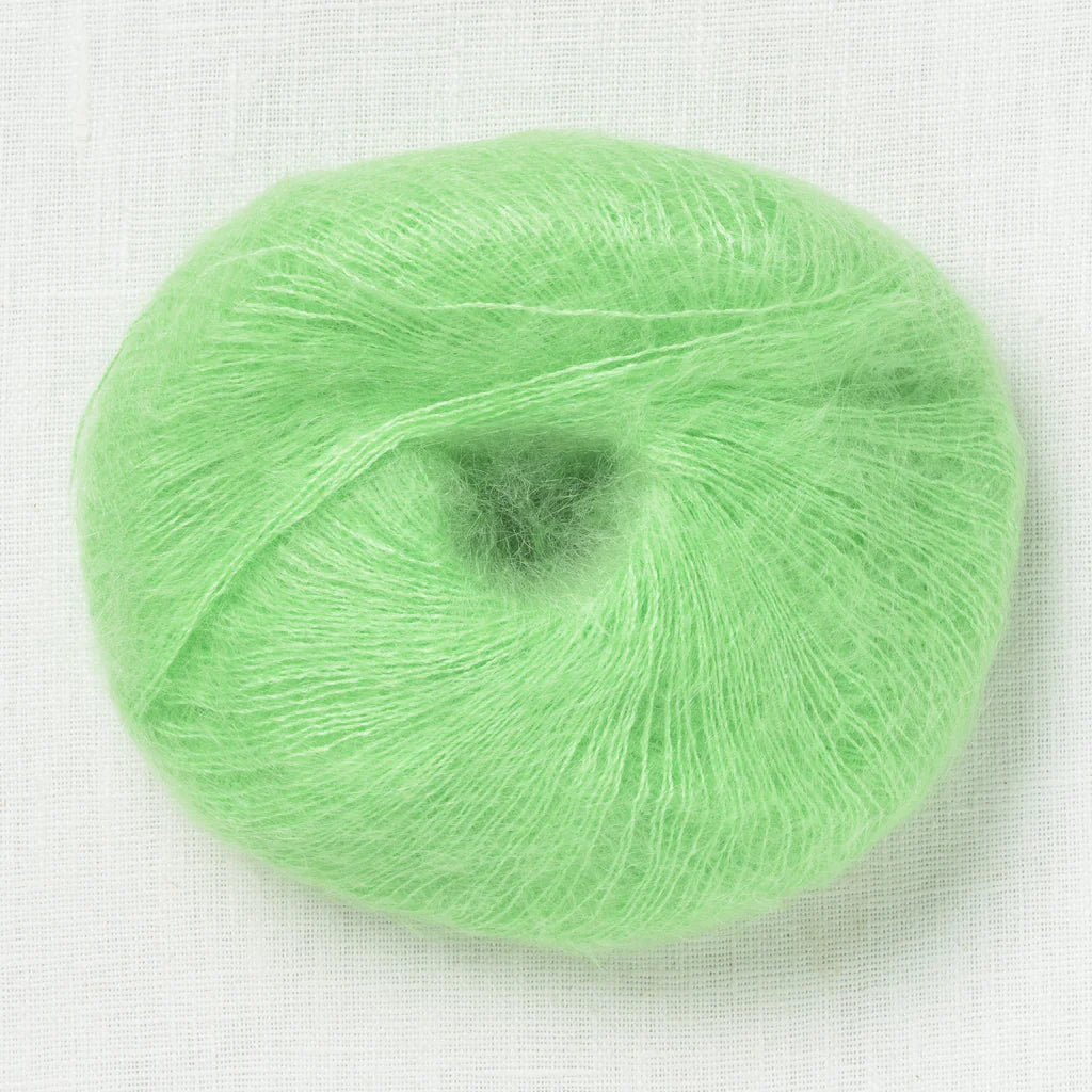 A fluffy ball of light electric green yarn.