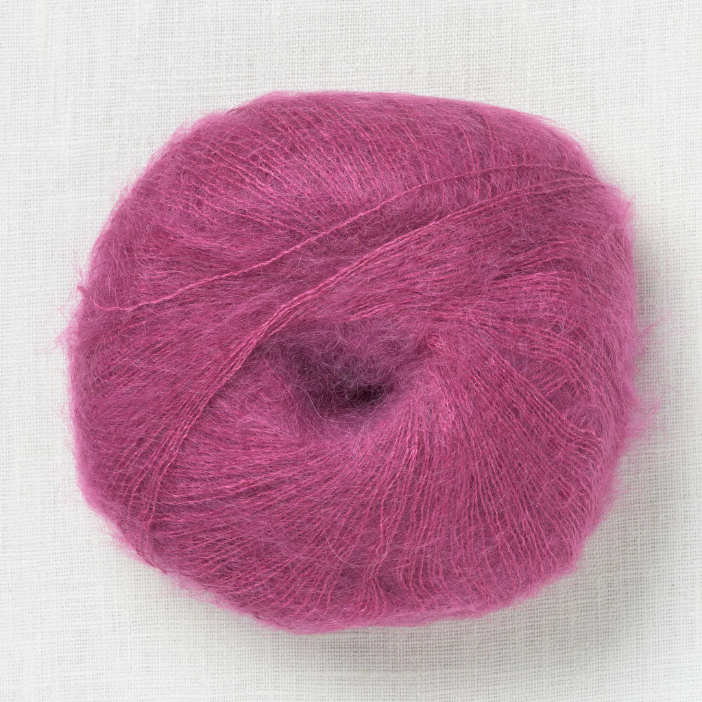A fluffy ball of pinkish-purple yarn.