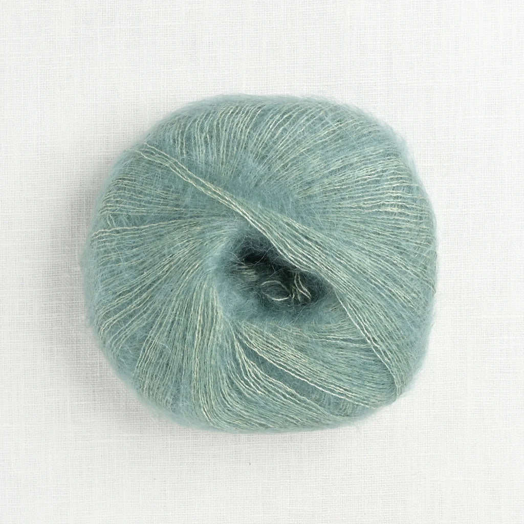 A fluffy ball of seafoam green yarn.