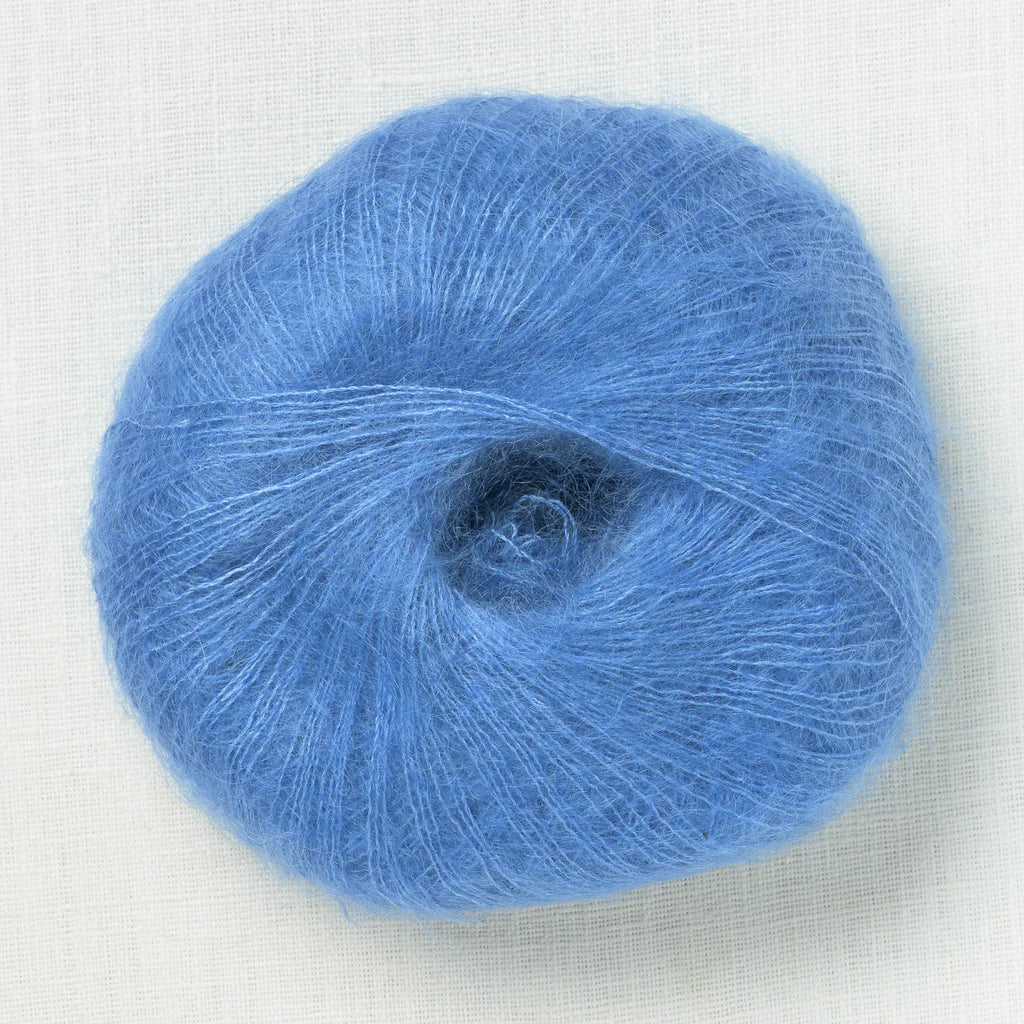A fluffy ball of light cobalt blue yarn.
