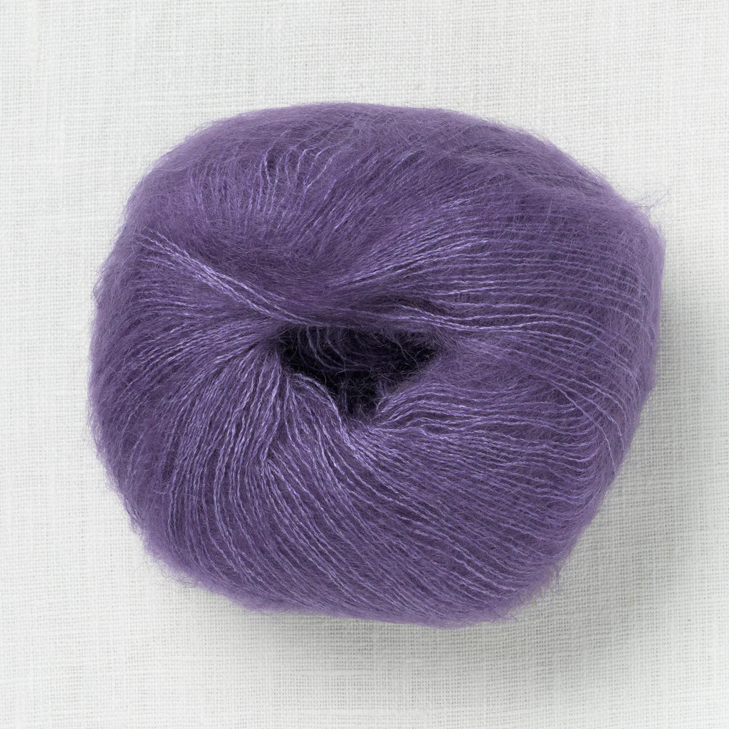 A fluffy ball of grape purple yarn.