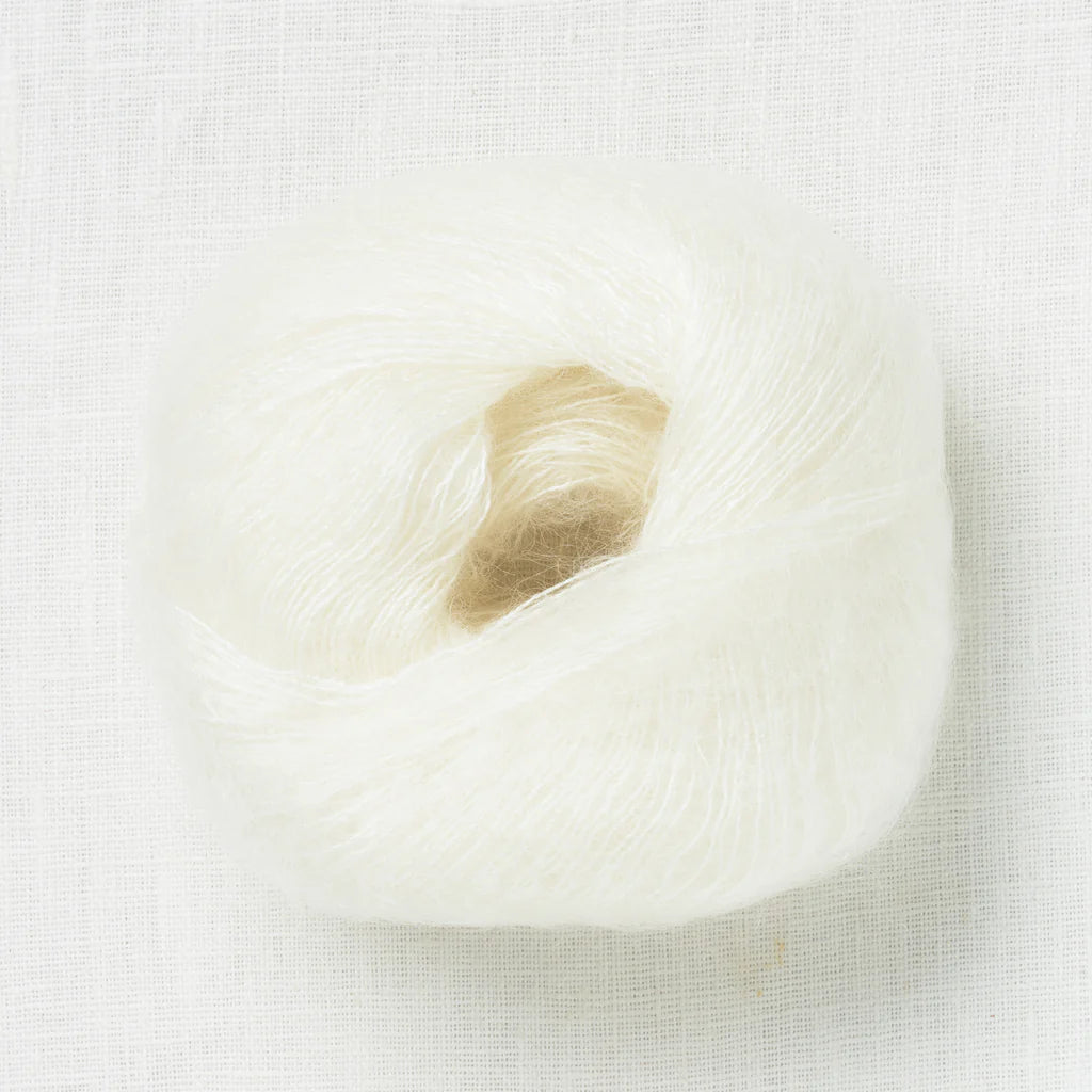 A fluffy ball of creamy white yarn.