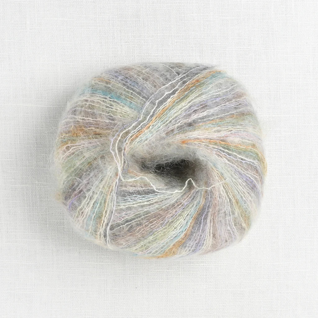 A fluffy ball of white, orange, brown, mint green, aqua blue, purple, baby pink and charcoal grey variegated yarn.