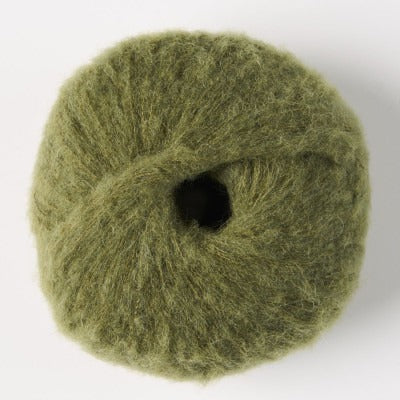 Ball of khaki green fluffy alpaca yarn.