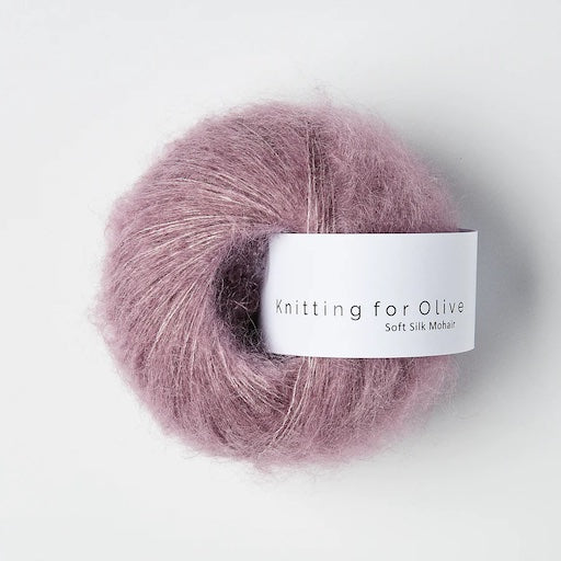 A ball of fuzzy purpleish-mauve yarn.