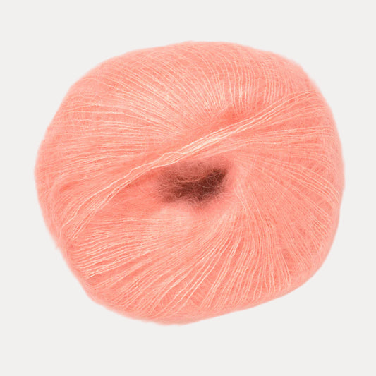 A fluffy ball of peachy pink yarn. 