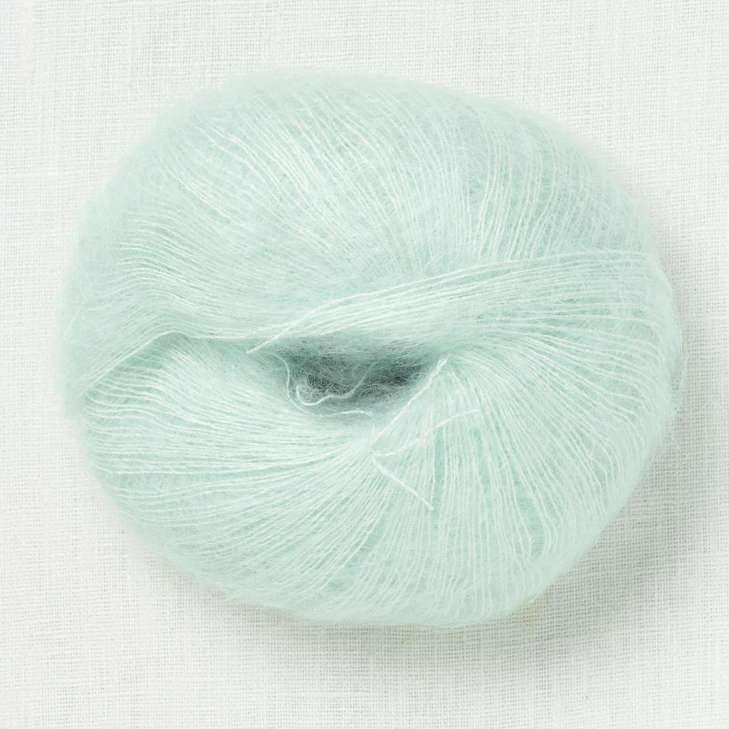 A fluffy ball of light pastel mint yarn. 