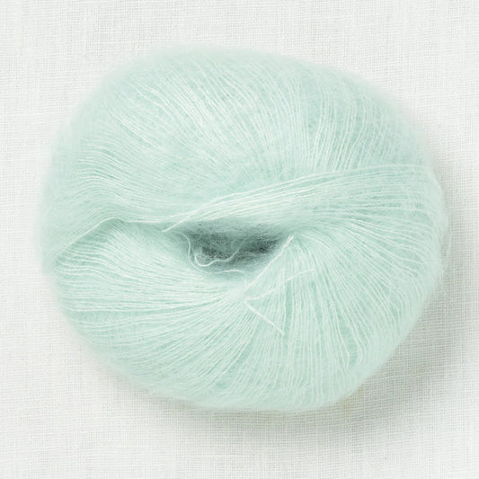 A fluffy ball of light pastel mint yarn. 