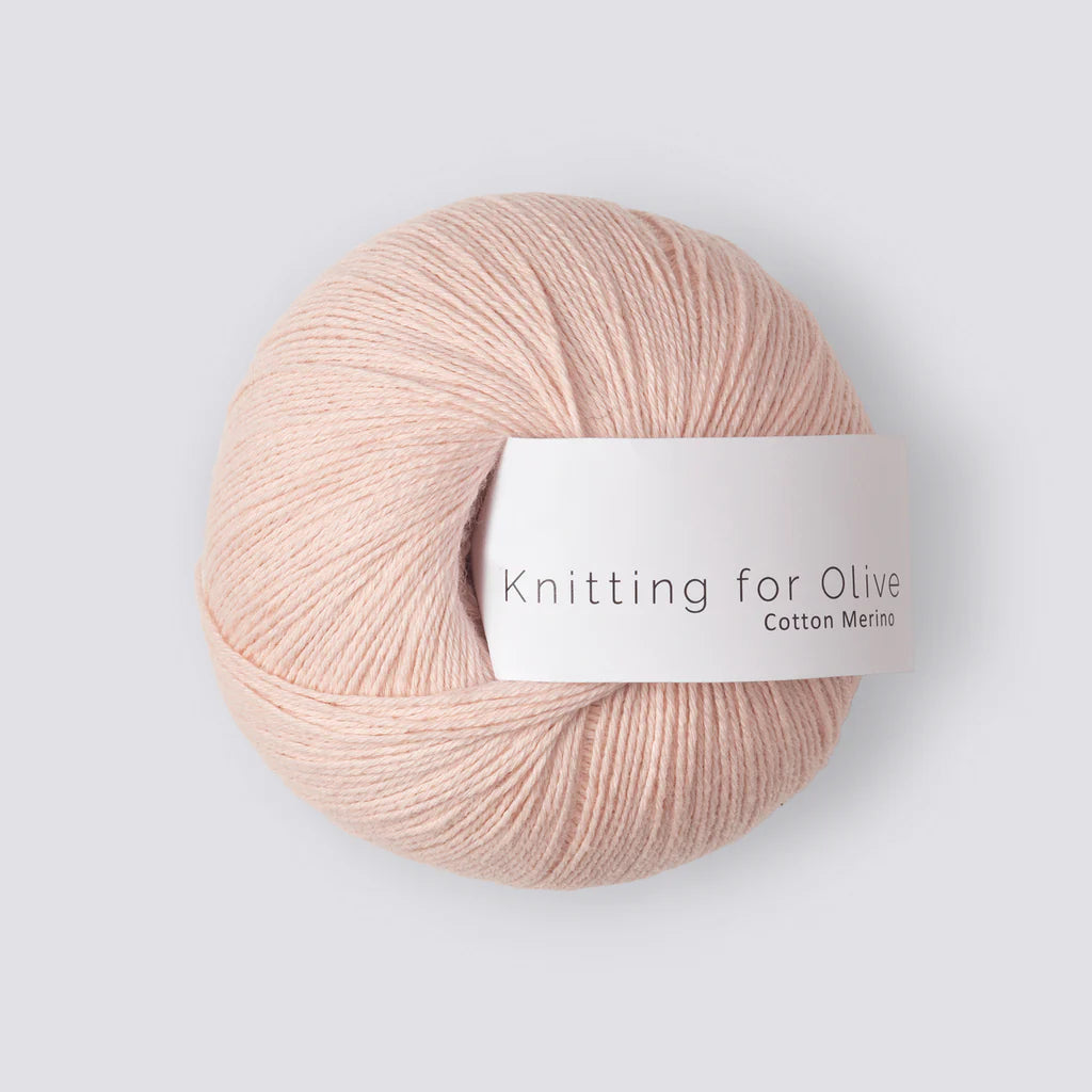 A ball of pastel pink yarn with a white 'Knitting for Olive' label, on a white background. 