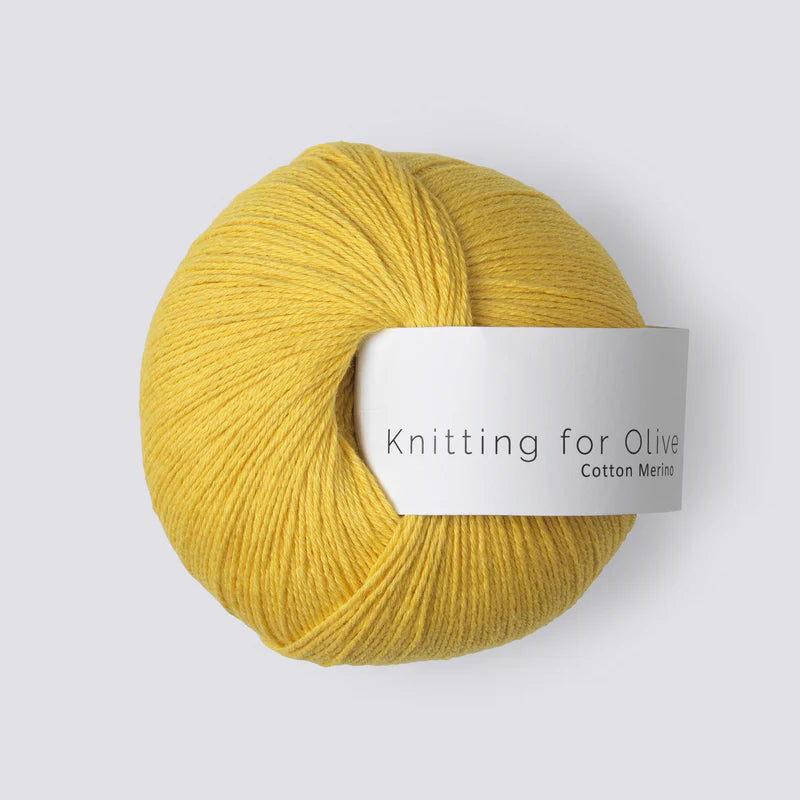 A ball of bright yellow yarn with a white 'Knitting for Olive' label, on a white background. 