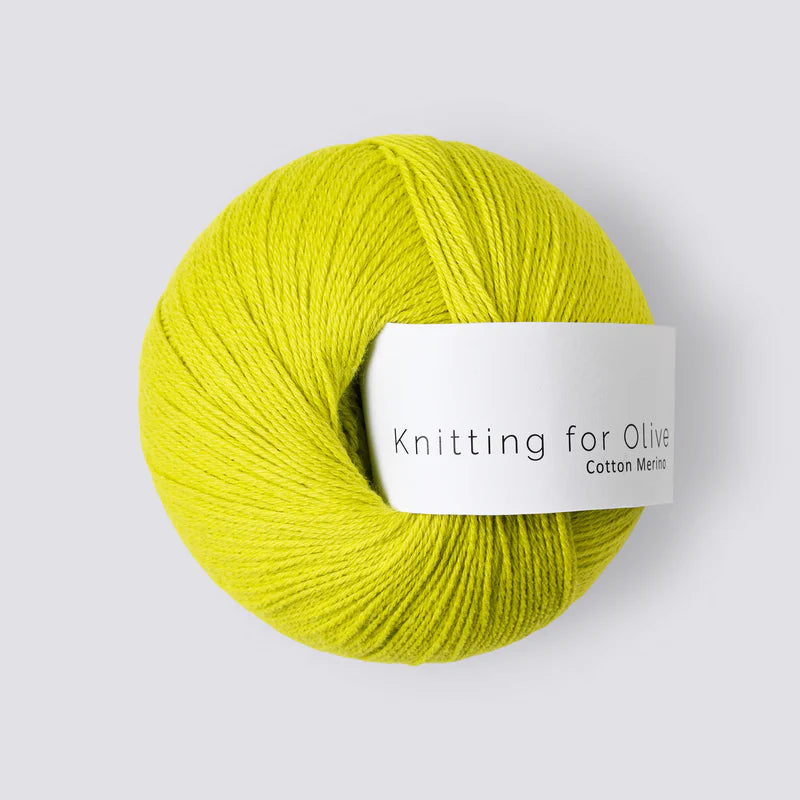 A ball of chartreuse yellow yarn with a white 'Knitting for Olive' label, on a white background.  