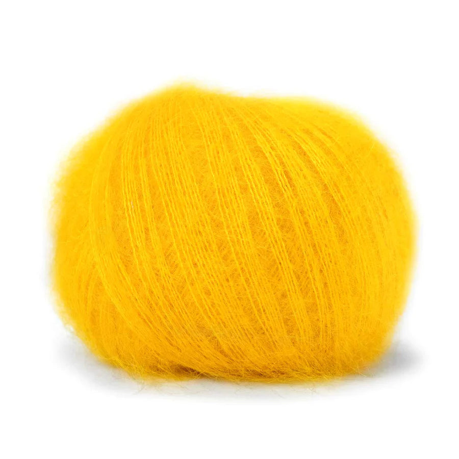 A ball of fluffy sunshine yellow yarn. 